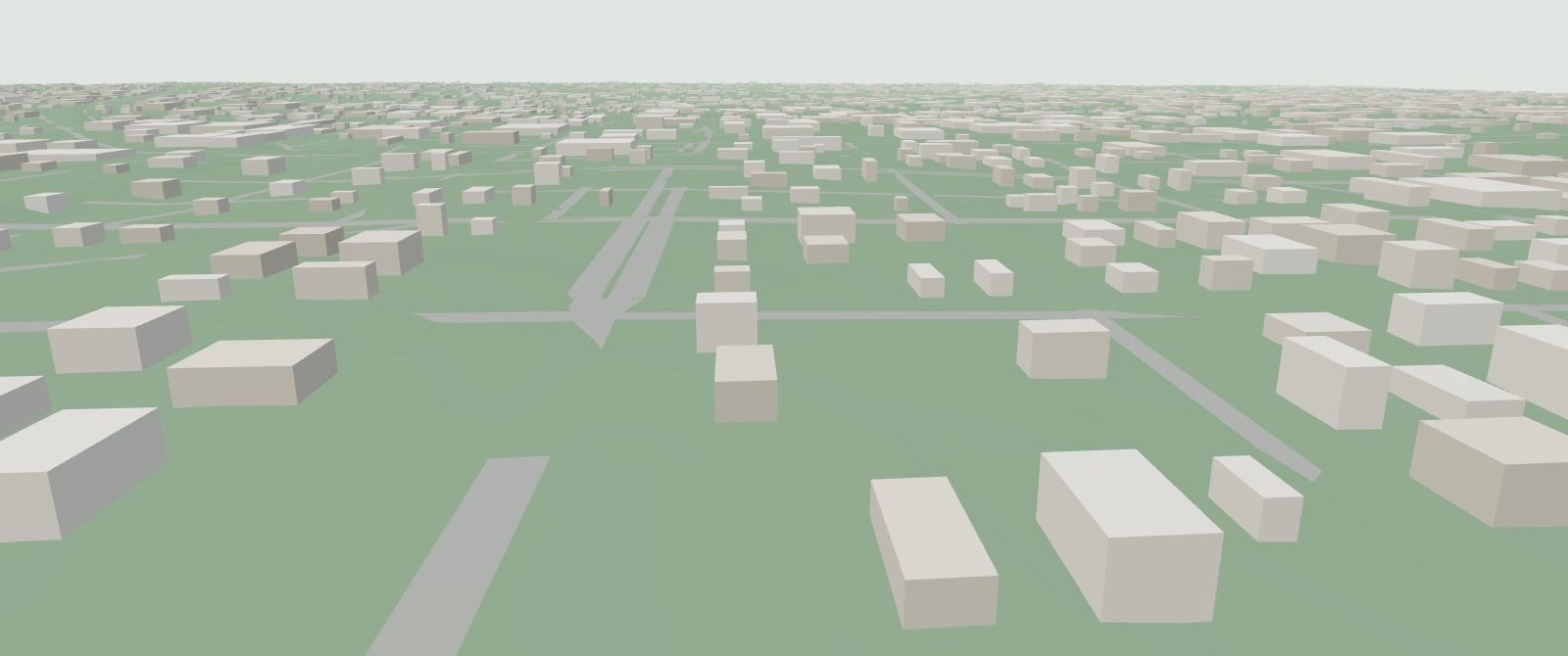 Griffin from the air, looking north over downtown: grey building blocks along the street grid on green rolling ground.